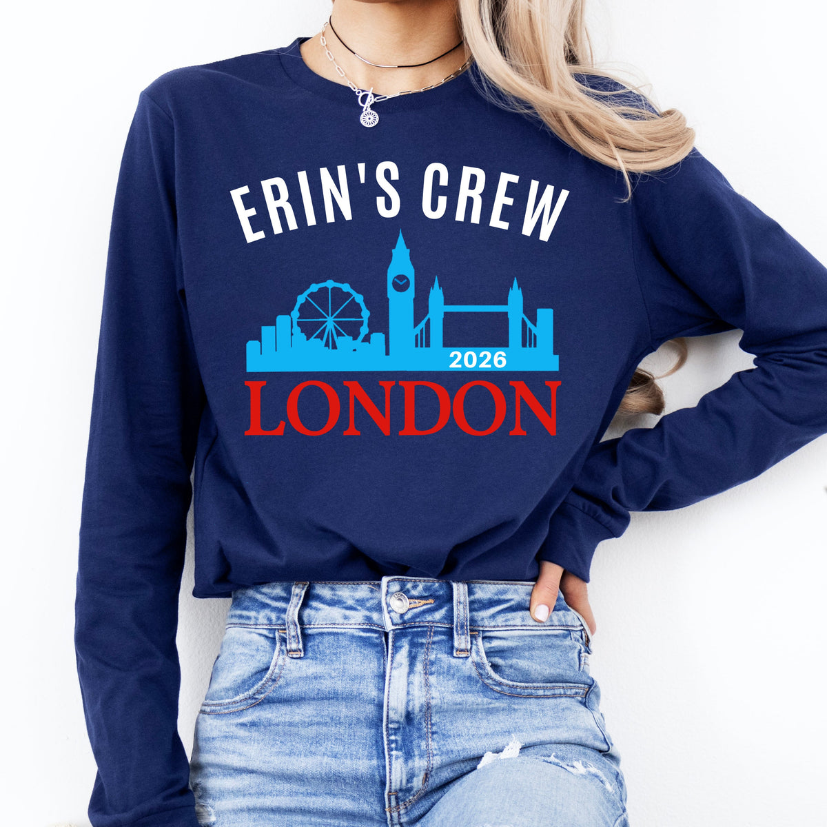 Person wearing a navy blue sweatshirt with 'Erin's Crew London 2025' design.