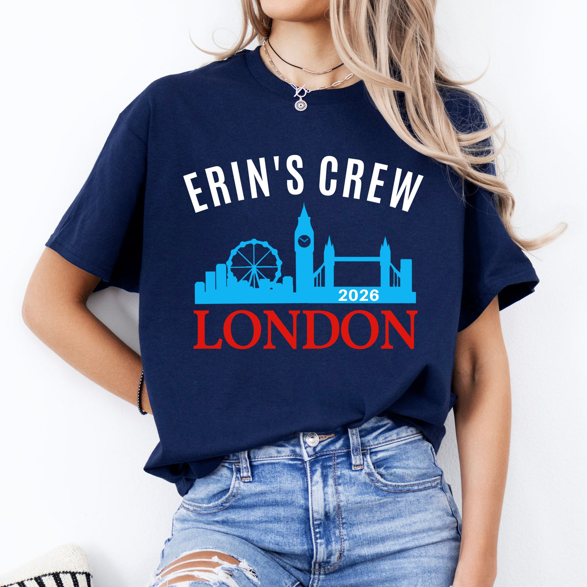 Person wearing a navy blue t-shirt with 'Erin's Crew London 2025' design on a white background